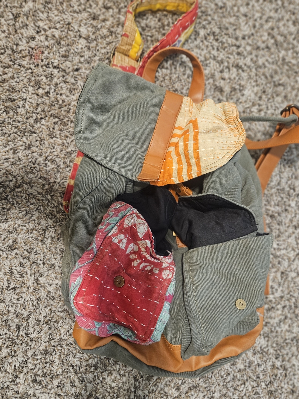 Green Canvas Backpack with Tan Leather Trim and Multicolor Accents